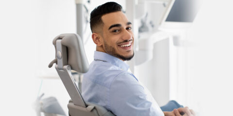 A man sitting after getting treatemnt for maxillofacial trauma at dental clinic near you