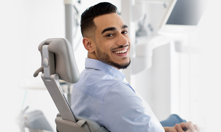 A man sitting after getting treatemnt for maxillofacial trauma at dental clinic near you