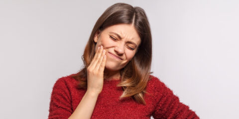 Girl having Temporomandibular joint pain before the treatemnt at the family dental care